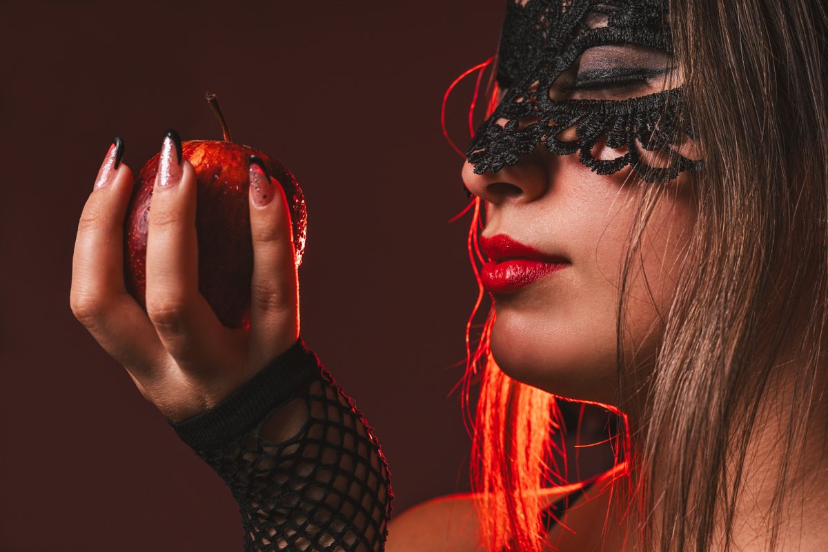 Illustrative close-up stock photograph of an adult in a black lace mask, not a real member from Australia